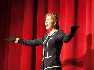 an actress performs on stage