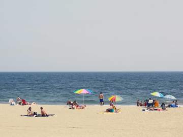 beachgoers enjoying rockaway beach