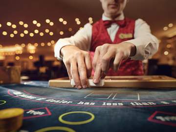 casino dealer shuffling cards
