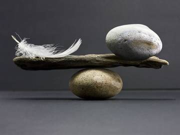 feather-and-stone-balanced-photo
