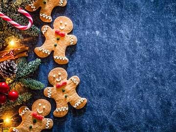 gingerbread cookies and pinecones on table