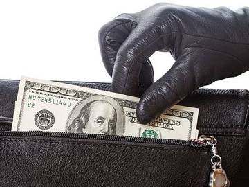 gloved-hand-stealing-money