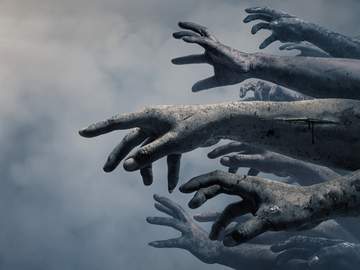 group of zombie hands reaching out