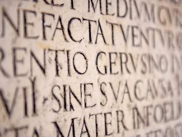 latin words engraved in stone