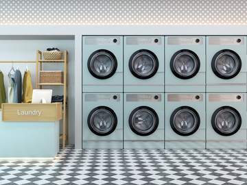 laundry shop interior with counter and washing machines