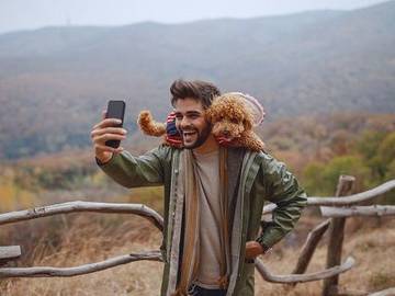 man-taking-selfie-with-dog