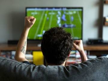 man-watching-football-at-home