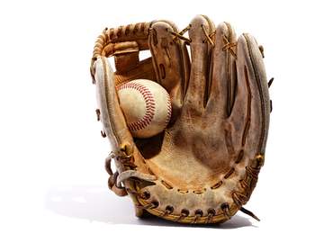 old baseball mitt with ball in it