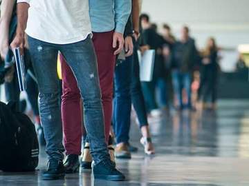 people queued up in airport 