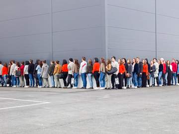 people waiting in long line