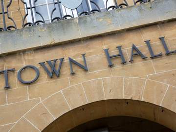 town hall sign on front of building