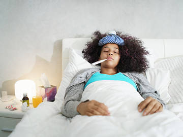 woman-sick-in-bed