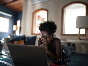 woman-watching-tv-on-laptop