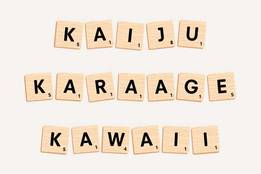 the words kaiju, karaage, and kawaii spelled out with scrabble tiles