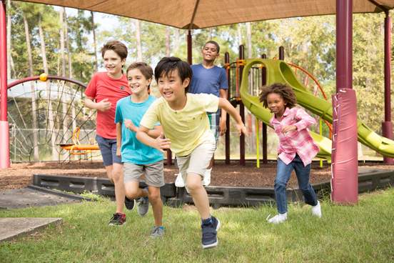  group of school children playing on school playground