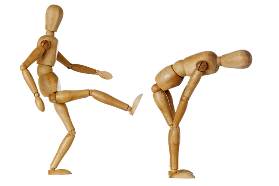 a figure being kicked in the butt