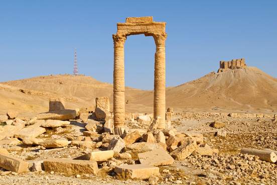 ancient ruins and a modern communication tower in palmyra syria 