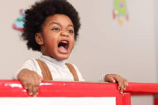 angry toddler in crib
