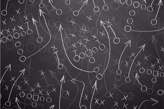 assorted american football plays diagrammed on chalkboard using xs and os