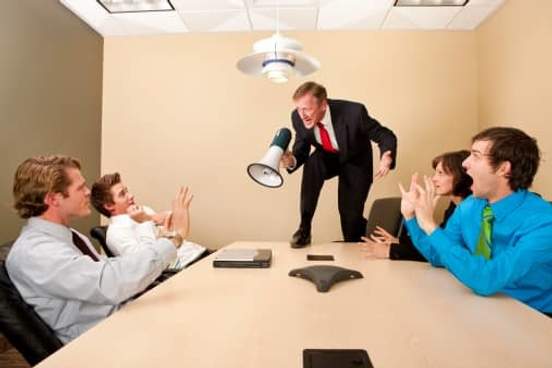 boss yelling at employees with megaphone