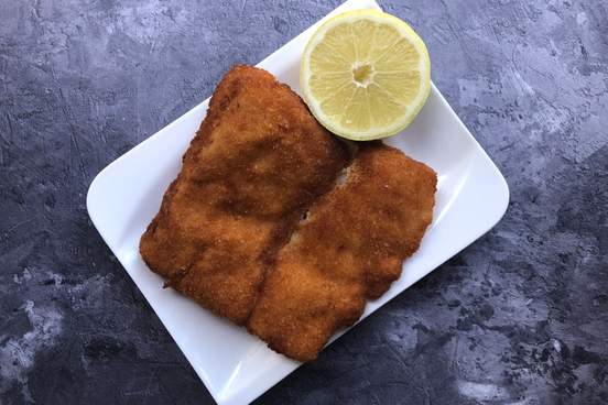 breaded cod fish kabeljau with lemon