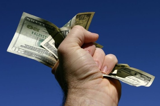 cash held in fist photo