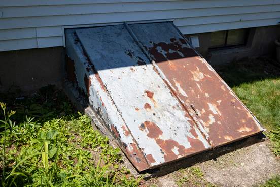 cellar doors on side of house