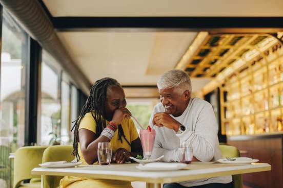 couple sharing a strawberry milkshake