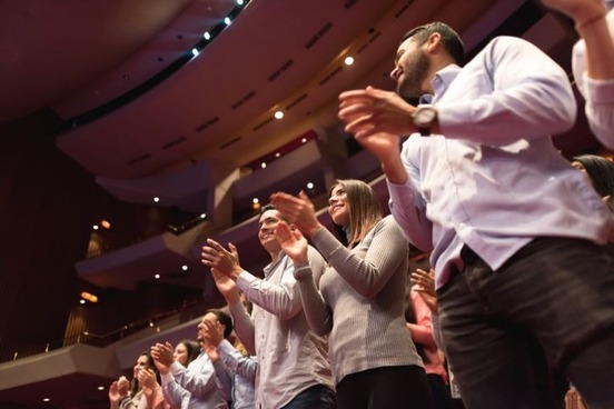 crowd giving standing ovation photo