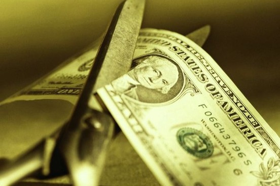 cutting a dollar photo