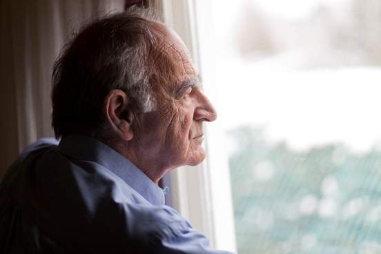 elderly man looking wistful