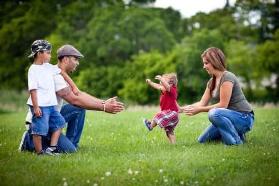 family in park with young child