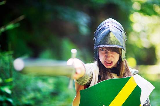 girl with helmet shield and sword looking ferocious