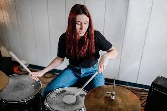 girl-playing-drums