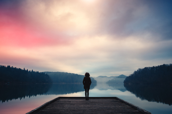 glowing sky at twilight by lake