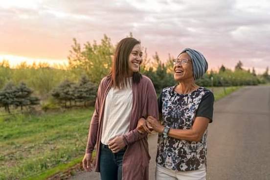 grandmother and granddaughter walking