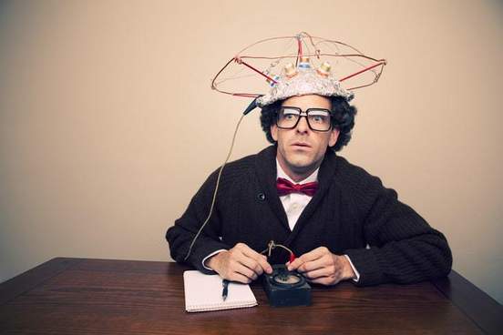 guy trying to use a mind reading device