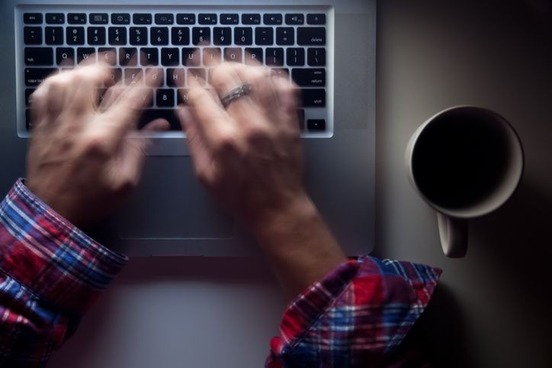 hands-typing-quickly-photo
