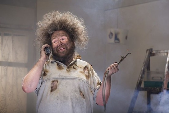 hapless guy holding burnt wire photo