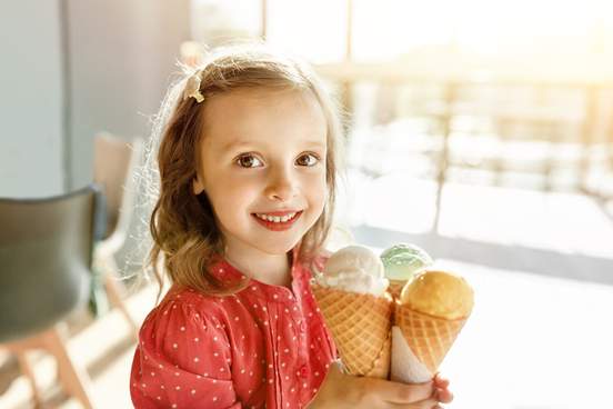 happy child with three ice cream cones