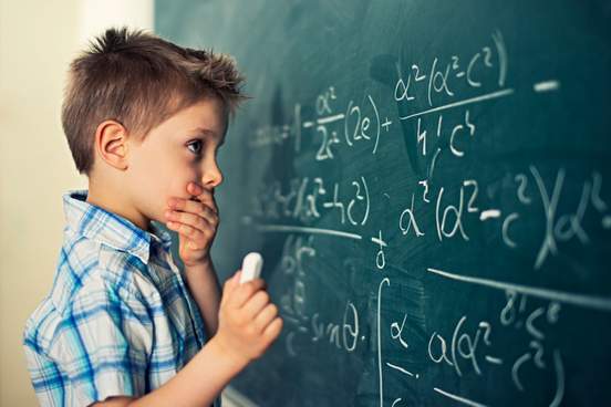 little boy in math class overwhelmed by the math formula