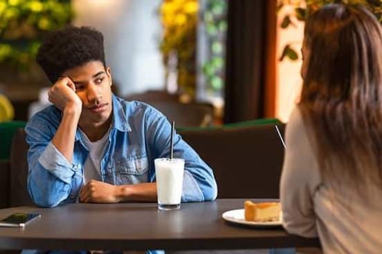 man bored by talk on date