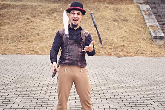 man juggling knives