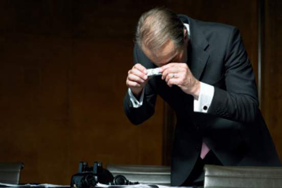 man photographing documents