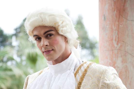 man posing in an 18th century type wig