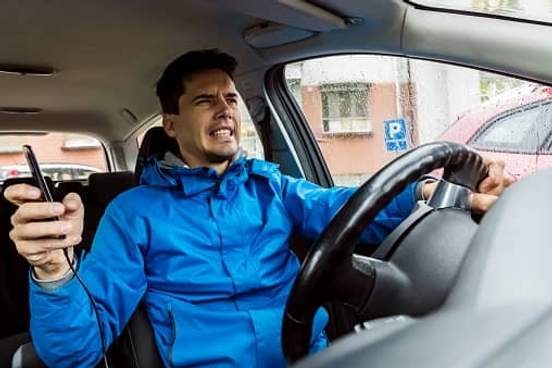 man speaking with gritted teeth