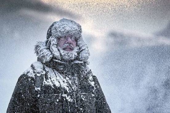 man-covered-in-snow