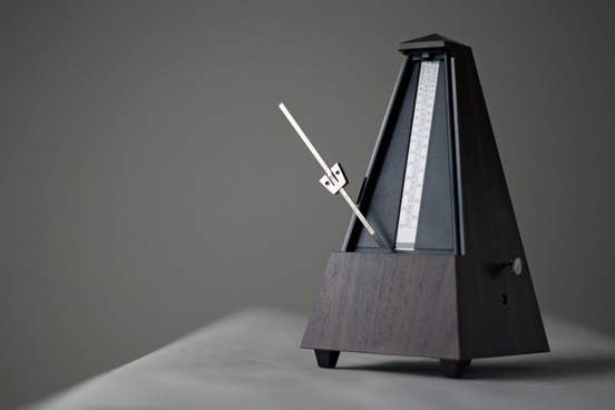 monochromatic metronome in action isolated and on a plain background