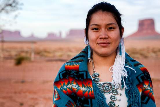 native american woman in desert wearing jewelry