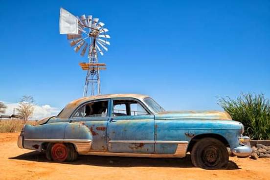 old car abandoned in desert